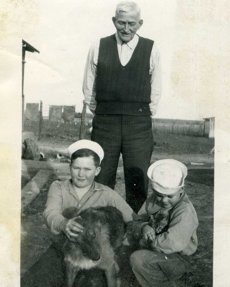 Roderick Stocking with his great-grandsons Harold "Fred" and Gary Stocking, and their dog, Snazzy