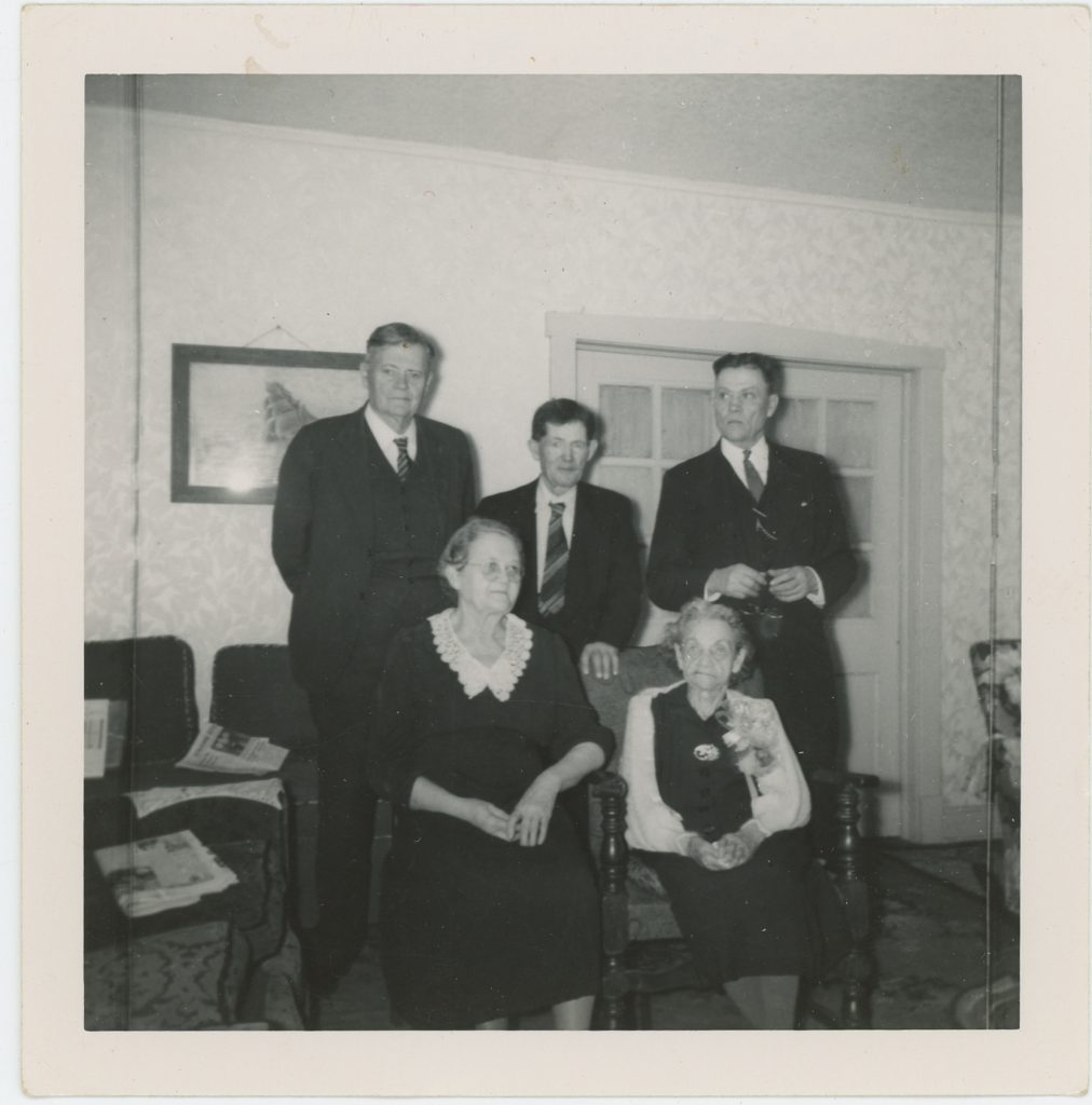 Maggie Corson McGinnis and her four children, left front, Maud, and back, Charles, Eugene, and Virgil McGinnis